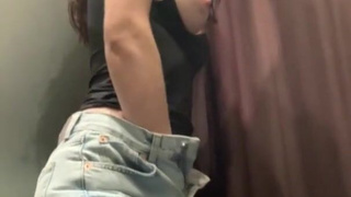 Hot MILF masturbates in the fitting room of the store